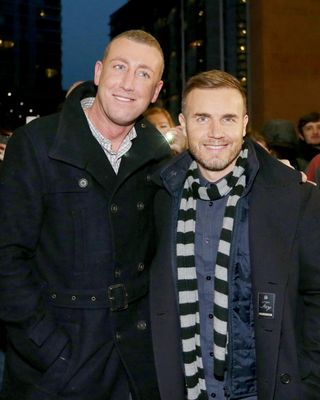 X Factor finalist Christopher Maloney with Gary Barlow in 2012