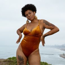 woman wearing orange bathing suit