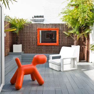 garden mirro with art chair and dog shaped chair
