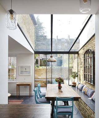 A side return kitchen extension with a glass roof and sliding glass doors