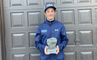 AJ August shows the Koppenbergcross trophy from his home in New York