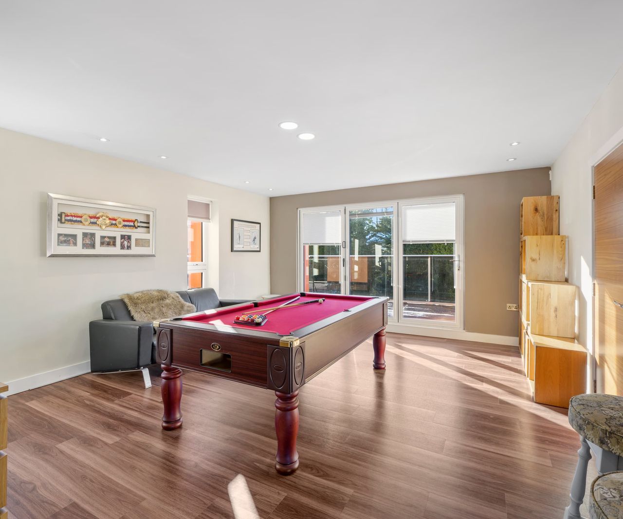 A games room with a pool table