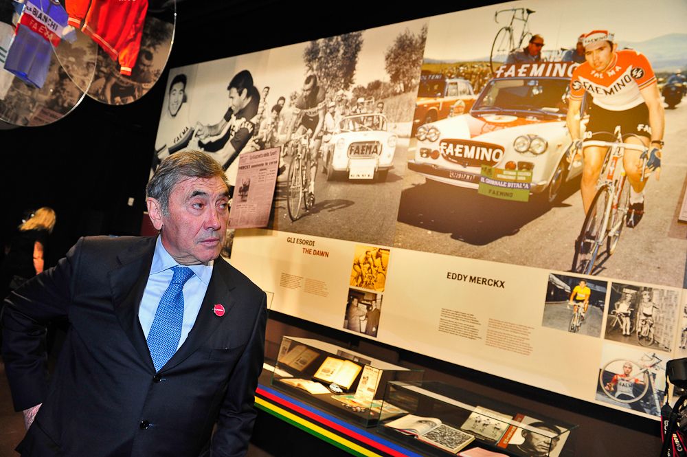 Eddy Merckx stands with the exhibition about about Faema cycling teams that recently opened at the Faema coffee machine museum.