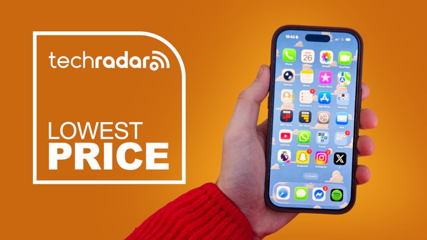 An iPhone 17 Pro being held in the hand on an orange background