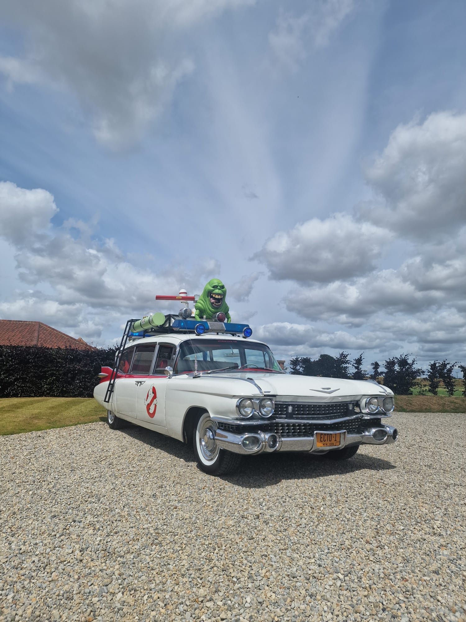 Images of the Ghostbusters car. It looks like the Ghostbusters car, but also it's parked outside of your parents house for some reason