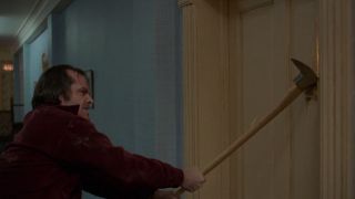 Jack Torrance swinging ax at door