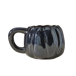 A pumpkin-shaped mug