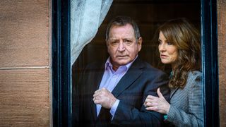 Lenny Murdoch (FRANK GALLAGHER), Lydia Murdoch (JACQUELINE LEONARD) looking out a window in River City