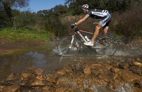An Orbea rider negotiates a stream crossing