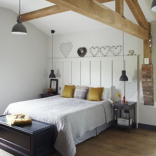 room with white wall and ceiling lamp