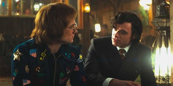 Taron Egerton and Richard Madden as Elton John and John Reid in Rocketman