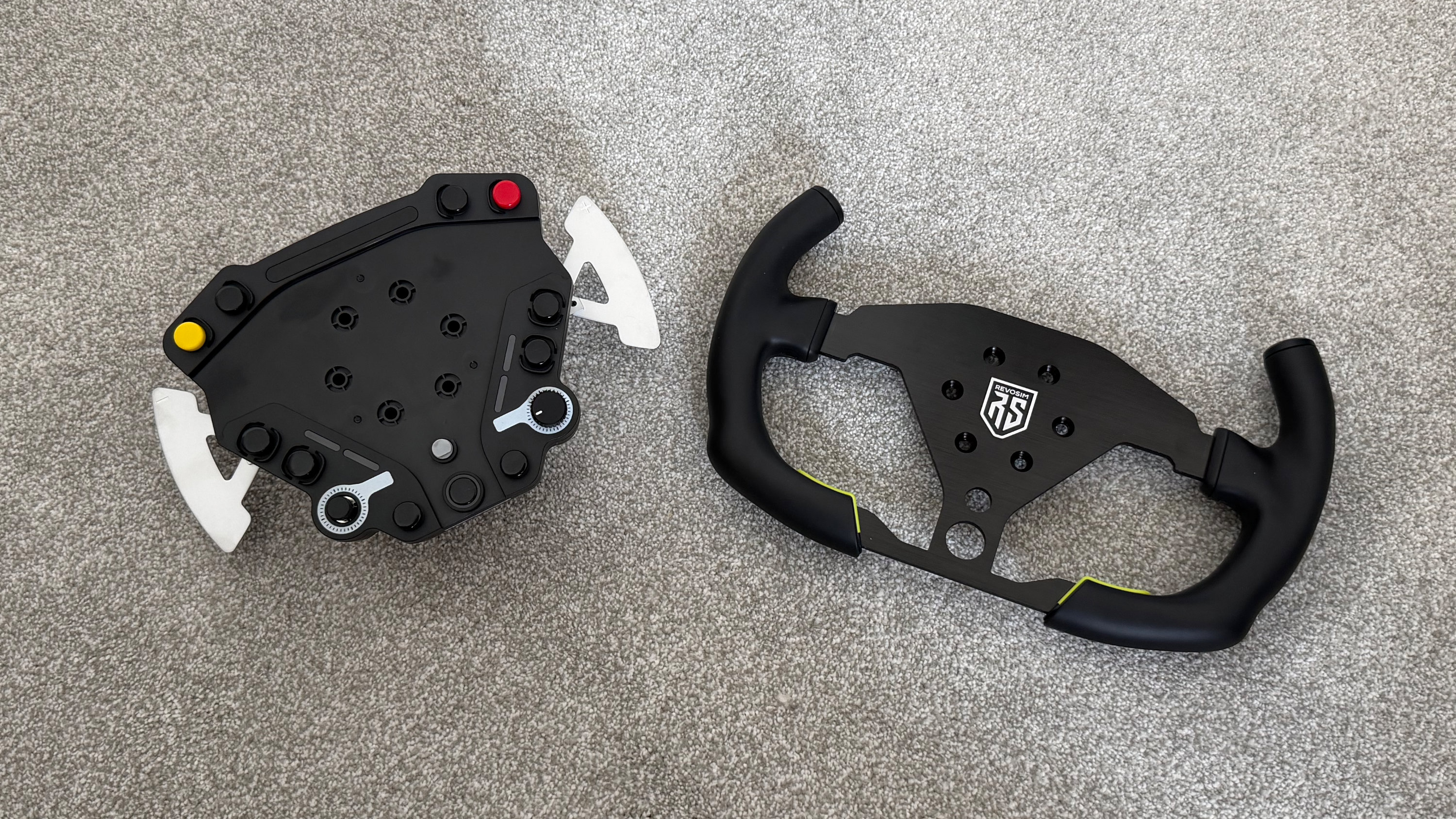 An expansion wheel hub for the Revosim RS Pure laid out on a carpet
