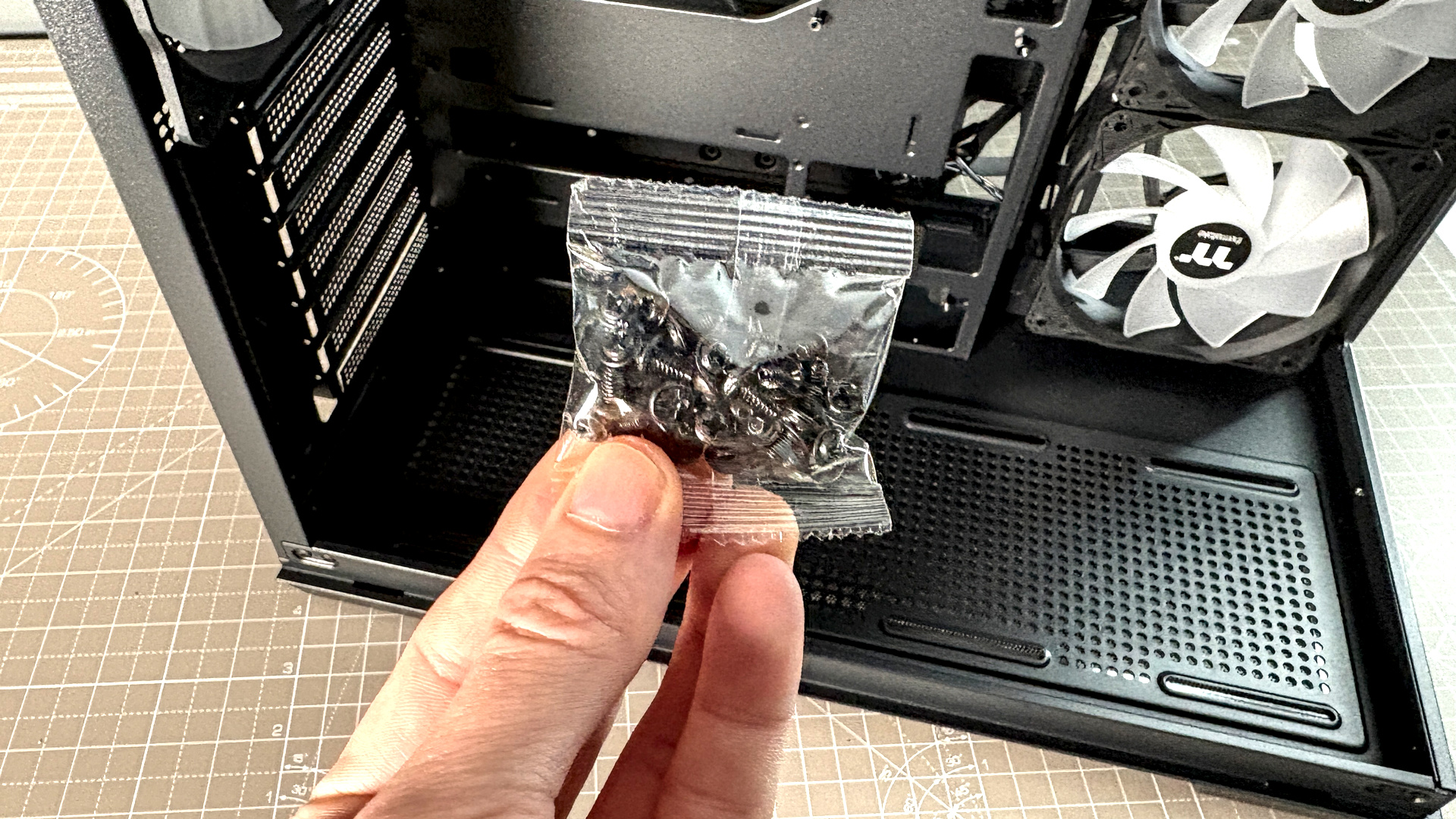 The Thermaltake View 380 WS ARGB on a desk with various components fitted.