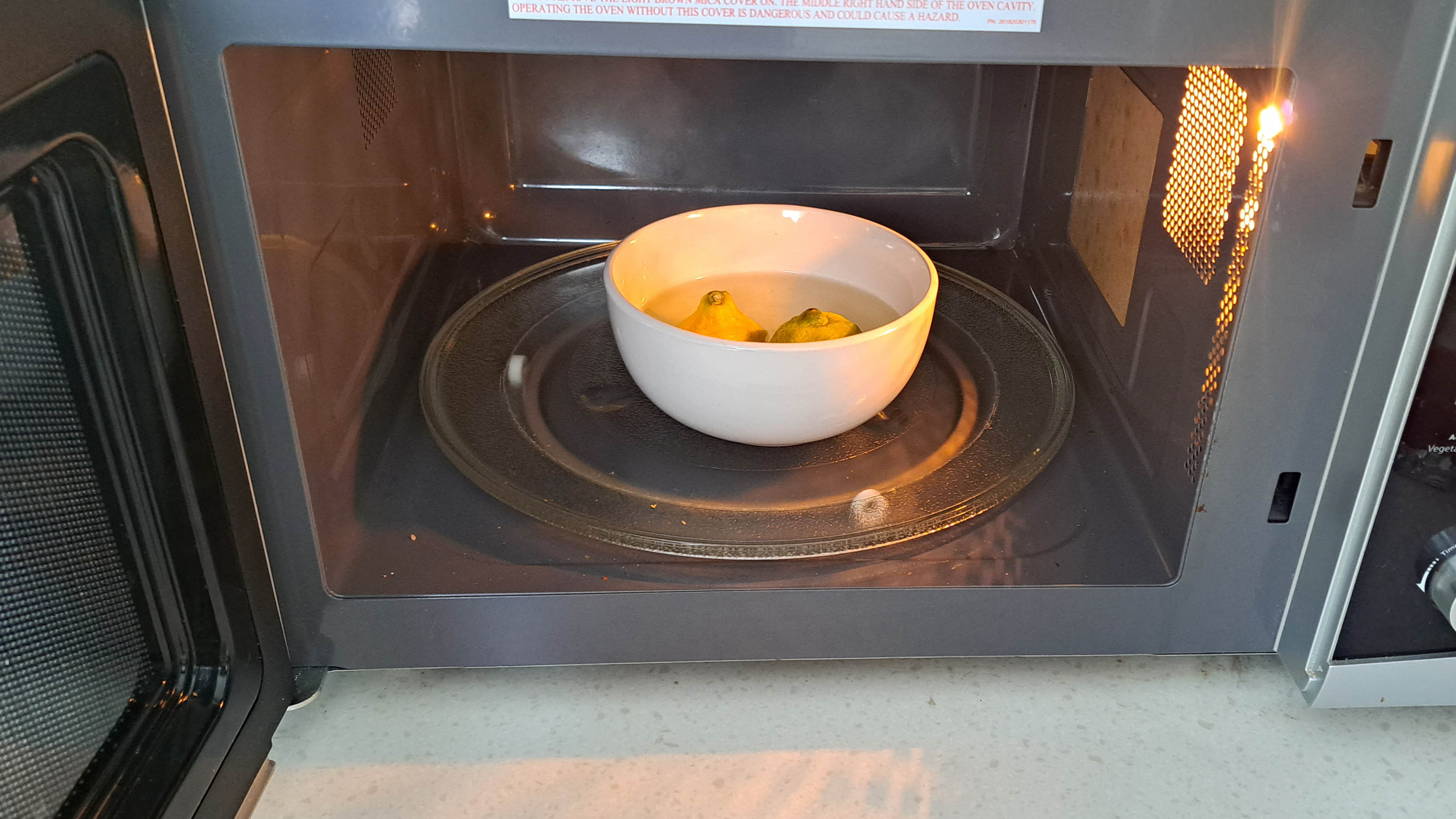 Bowl of lemons in microwave