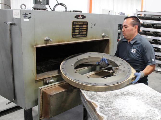 Weighing about 65lb, the clamped mold is inserted into an oven for curing