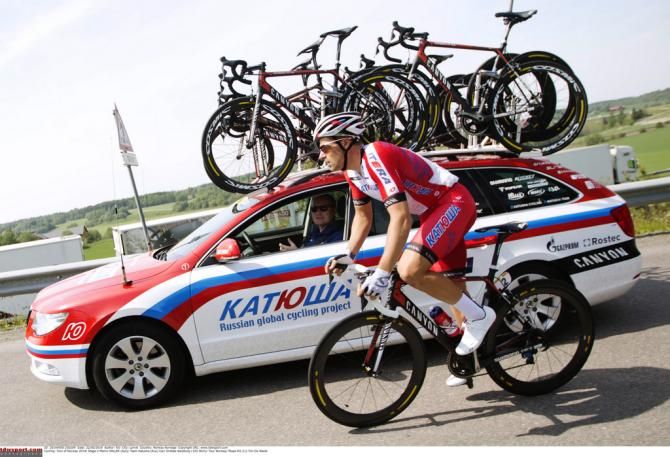 Marco Haller drops back to the Katusha team car