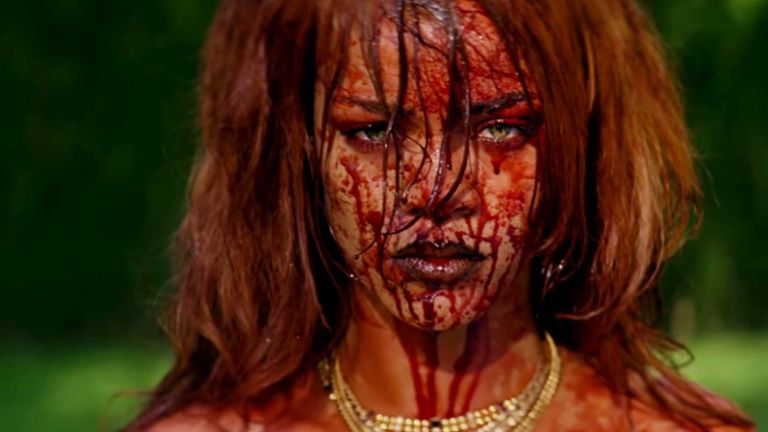 Rihanna with blood on her face