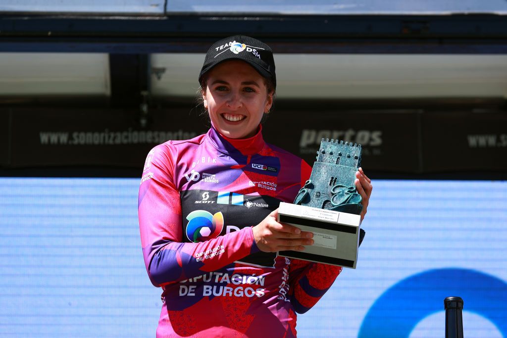 LAGUNAS DE NEILA SPAIN MAY 22 Juliette Labous of France and Team DSM celebrates at podium as Pink Leader Jersey winner during the 7th Vuelta a Burgos Feminas 2022 Stage 4 a 1251km stage from Covarrubias to Lagunas de Neila 1867m VueltaBurgos BurgosFem UCIWWT on May 22 2022 in Lagunas de Neila Spain Photo by Gonzalo Arroyo MorenoGetty Images