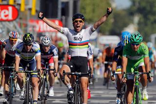 Mark Cavendish wearing the world champion's rainbow jersey celebrates winning the final stage of the 2012 Tour