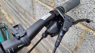 Close up of a black Shimano Acera shifter