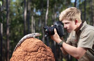 Rob Irwin photographing a lizard