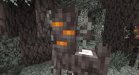 Minecraft - a greyish tree creaking with orange eyes in a pale forest