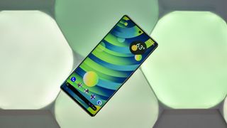 Pixel 6 Pro with green wallpaper on Nanoleaf Shapes lights