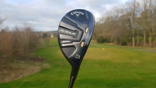 Callaway Rogue ST MAX Hybrid and its black club head design on the golf course