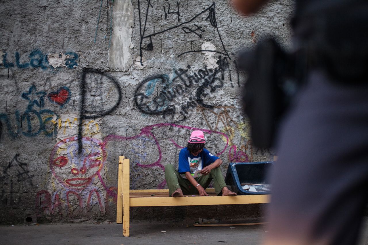 An addict uses cocaine in Sao Paulo, Brazil. 