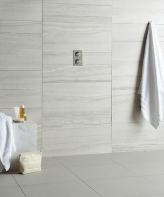 large white floor tiles in minimalistic bathroom