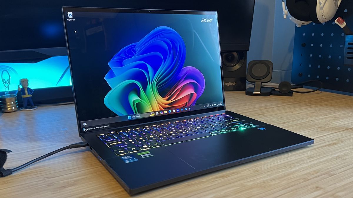 Acer Predator Triton 14 AI gaming laptop on a wooden desk
