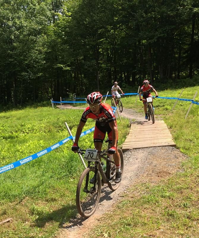 Samuel Tremblay trains on the cross country course with teammates