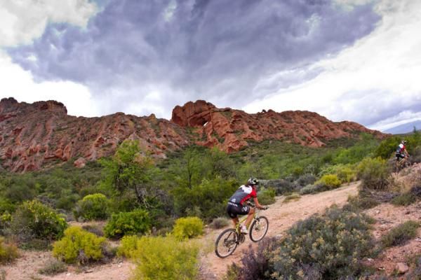 Germans Max Fridrich and Nadine Rieder (Ergon 24H Racing Team) pass the Red Stone formations on their way to winning the Mixed category
