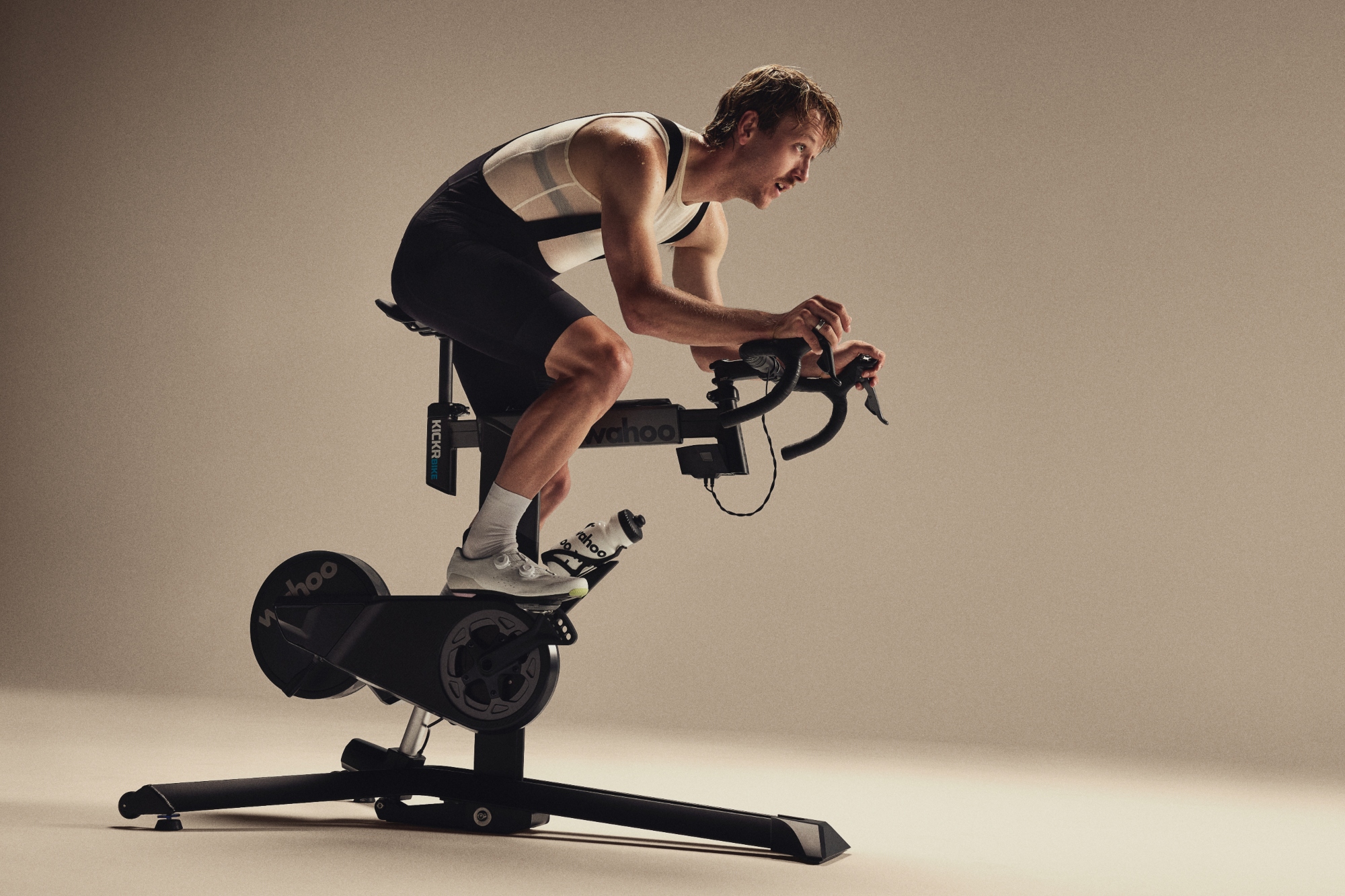 The Wahoo Kickr Bike Pro ridden by a white man in black shorts