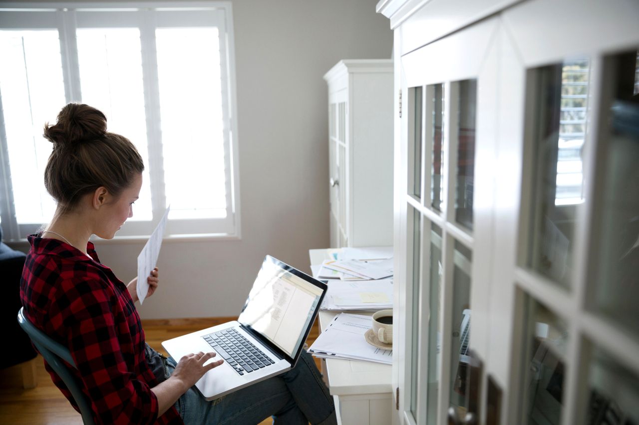 A woman paying bills.