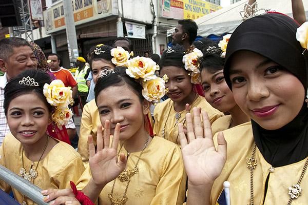 Some Malaysian performers await the start in Ayer Tawar for stage four of the tour into the Cameron Highlands.