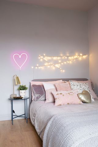 Girls bedroom with fairy lights and lilac walls