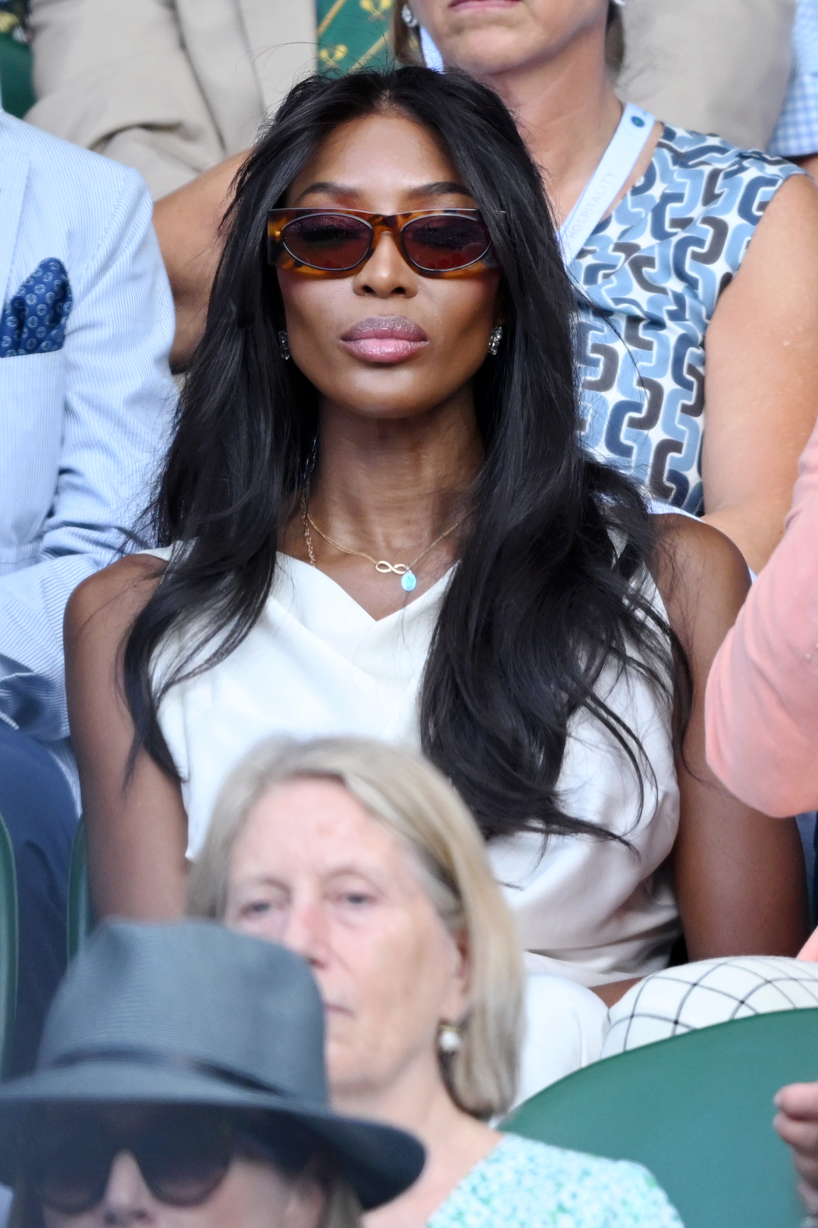Naomi Campbell wearing curtain bangs