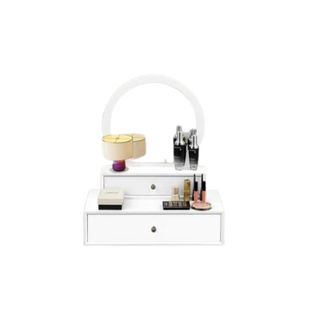 Aakiyah Wall Mounted Beveled Vanity Mirror in white with beauty products scattered throughout