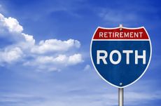 A highway route sign says "Retirement: Roth."