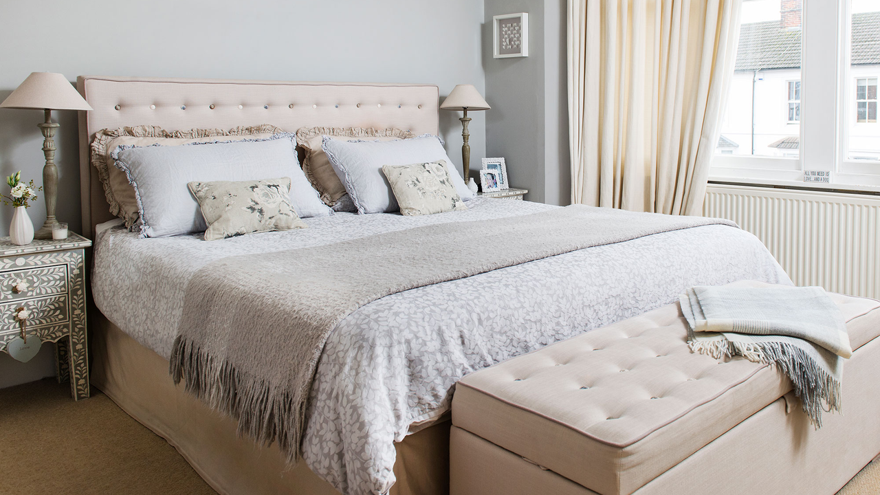 bedroom with grey wall and bed