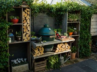 an outdoor kitchen in a shady spot