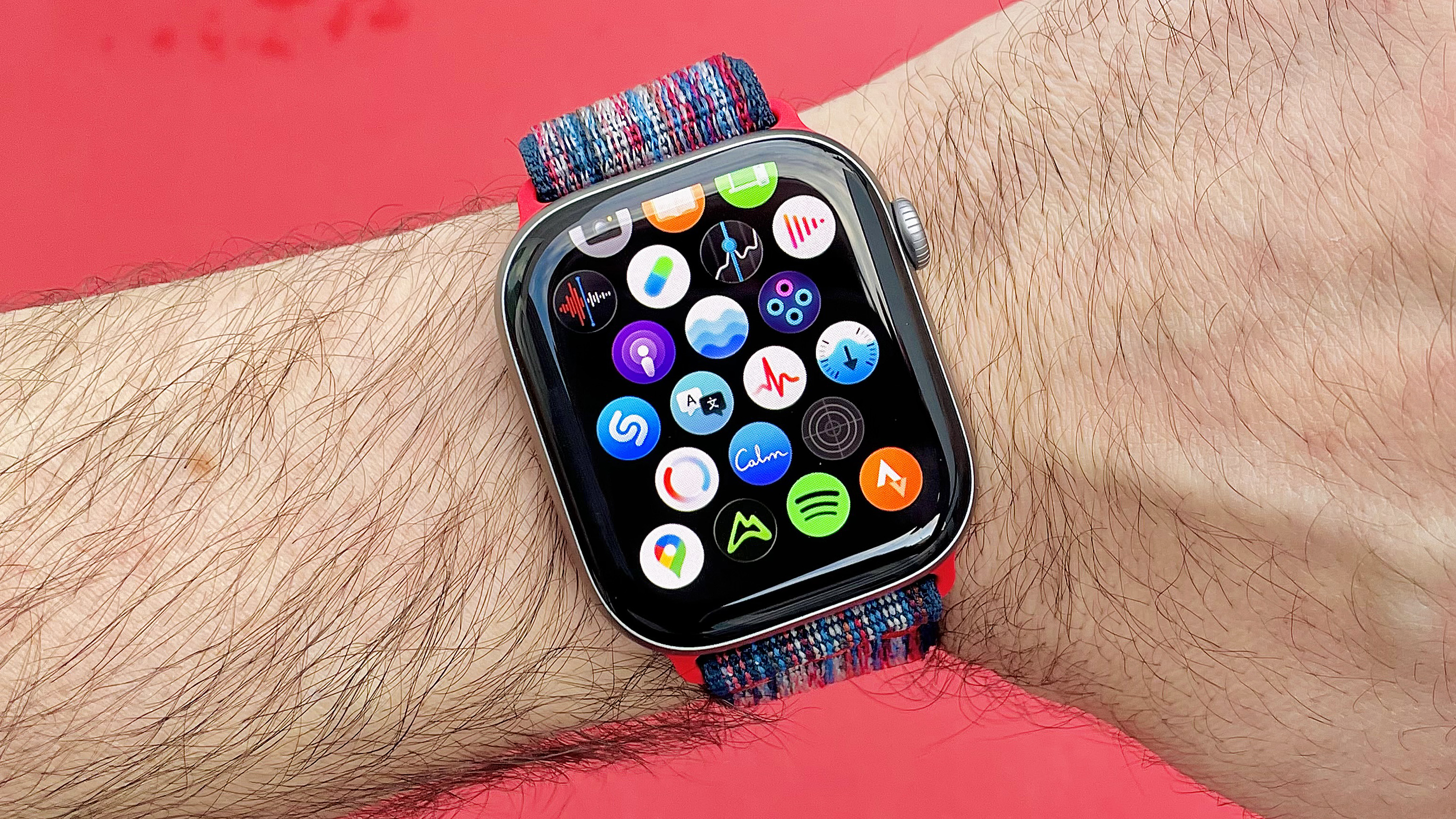 Close up of the Apple Watch 11 on a user's wrist with the app icon screen displayed