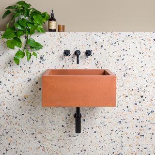 Inject warmth into your bathroom with a earthy toned sink