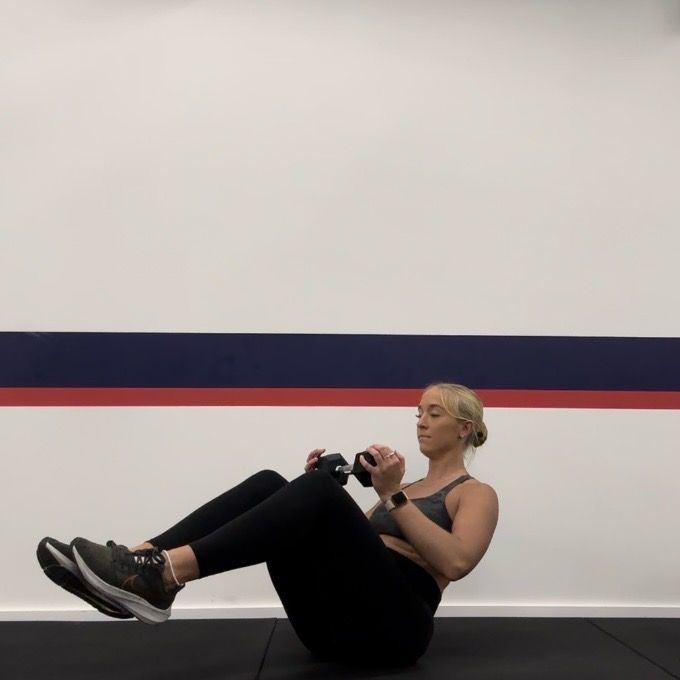 Personal trainer Klaudia Lucia demonstrating a Russian twist