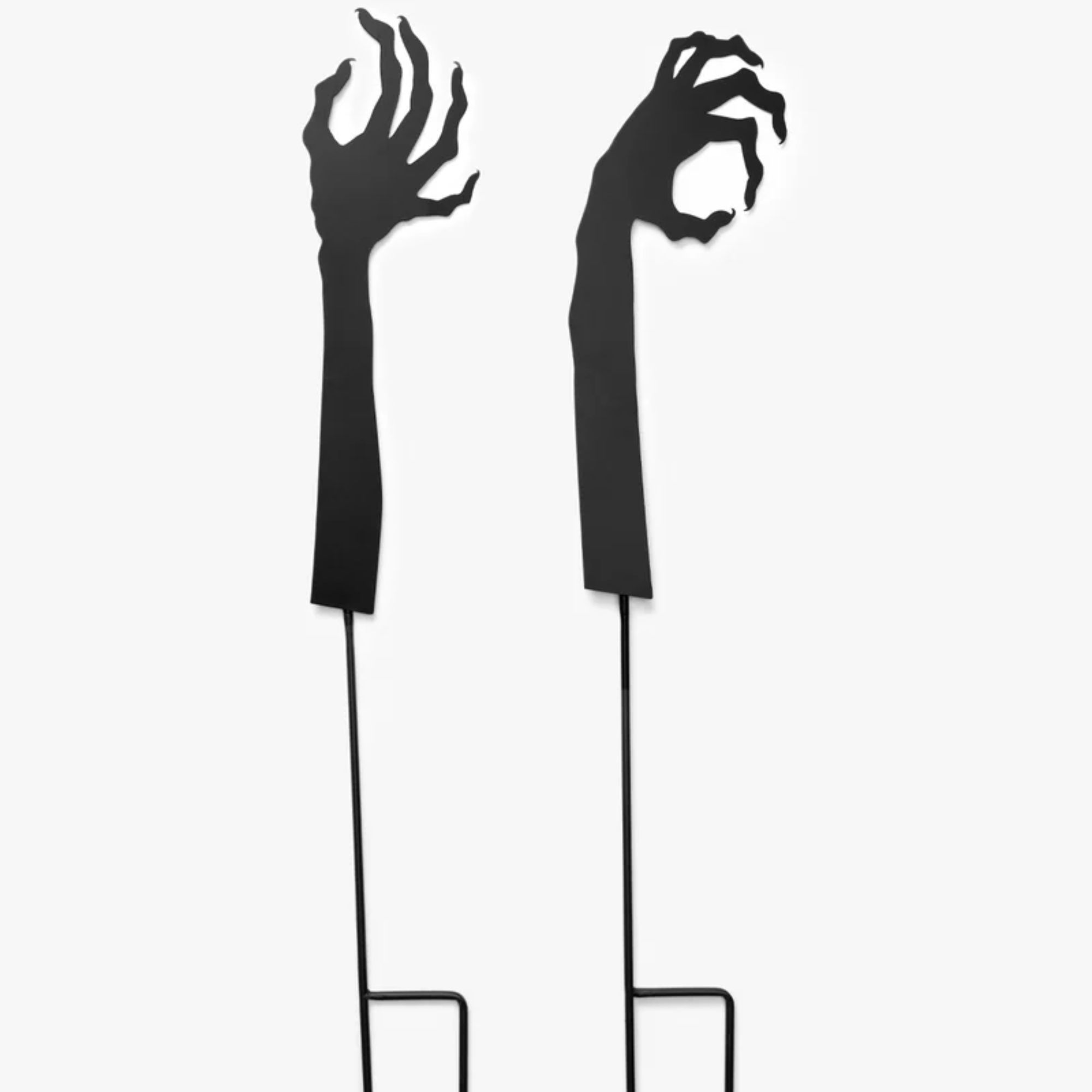 Black metal yard stakes in the shape of monster hands