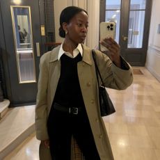 @sylviemus_wearing a white shirt and black trousers