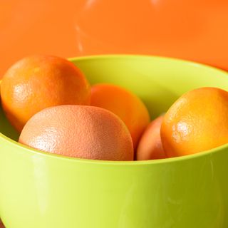 A bowl of oranges and grapefruits