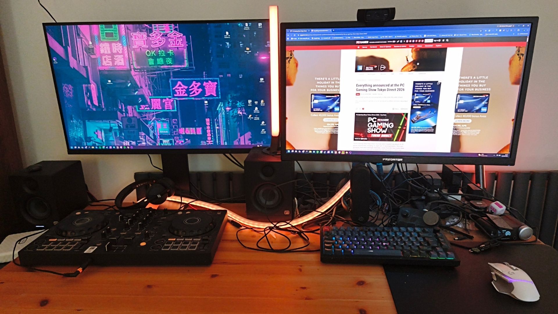 Jake Tucker's desk, showing two gaming monitors, a keyboard and mouse, plus a FLX4 DJ controller