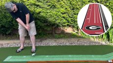 The Perfect Practice Putting Mat Collegiate Edition being tested by a golfer